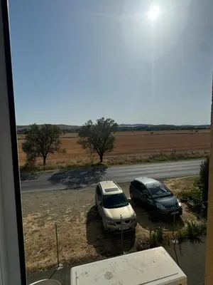two cars parked on the side of a road at Sunny day 5 in Tŭnkovo
