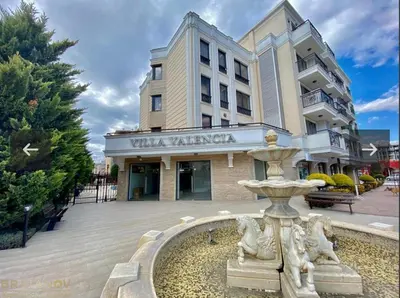 a water fountain in front of a building at Villa Valencja Apartments in Sunny Beach