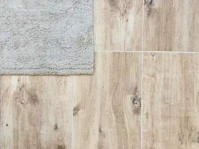 a wooden floor with a rug on top of it at Skyline Loft in Varna City