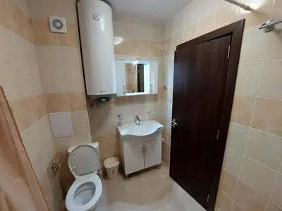 a bathroom with a toilet and a sink at Апартаменти Делукс 2 in Burgas City