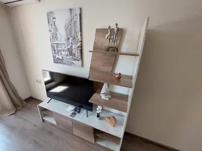 a staircase with wooden shelves in a room at Апартаменти Делукс 2 in Burgas City