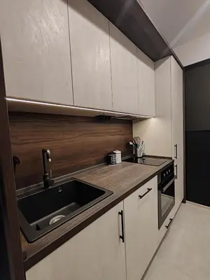 a kitchen with a sink and a stove at SOHO apartments in Burgas City