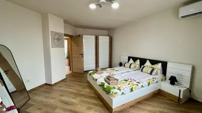 a bedroom with a large bed in a room at Atelier Pepi in Varna City