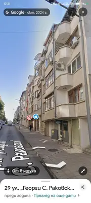 an empty city street with buildings on the side at Boutique 2-Bedroom Apartment Downtown Burgas in Burgas City