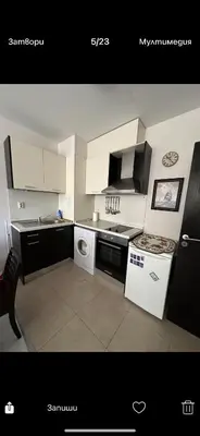 a kitchen with a stove and a sink and a dishwasher at Апартаменти Нино 1 in Sozopol