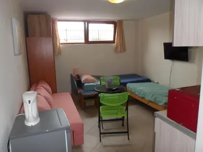 a small room with a couch and a bed at Le studio Summer Breeze in Sunny Beach
