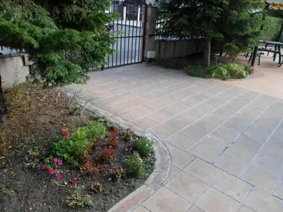 a patio with a fence and some flowers at Le studio Summer Breeze in Sunny Beach