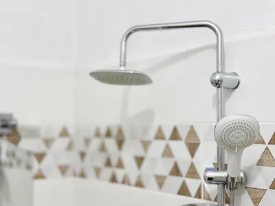 a kitchen with a shower head and a sink at SeaSide 2BR Central apartment in Varna City