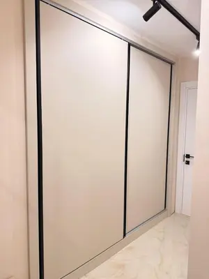 a sliding glass door in a room with white walls at Seaside Home in Burgas City