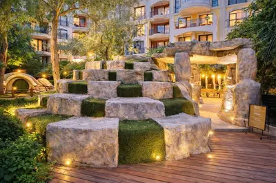 a rock garden in front of a building at Harmony Suites 2 Private Studio 219 in Sunny Beach