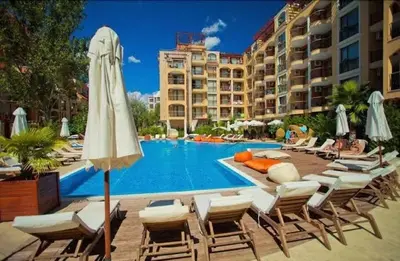 a pool at a hotel with chairs and umbrellas at Harmony Suites 2 Private Studio 219 in Sunny Beach
