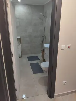 a bathroom with a toilet and a shower at Emperium, Style, Coziness and tranquility by the sea in Sveti Vlas! in Sveti Vlas