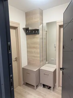 a bathroom with two drawers and a mirror at Valena Royal apartment in Chernomorets