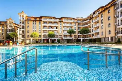 a large swimming pool in front of a large building at Spacious apartment with 2 bedrooms and 2 bathrooms complex ROYAL SUN Sunny beach in Sunny Beach