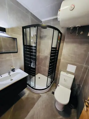 a bathroom with a shower and a toilet and a sink at Spacious apartment with 2 bedrooms and 2 bathrooms complex ROYAL SUN Sunny beach in Sunny Beach