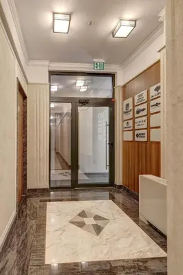 an entrance to a building with a door and a tile floor at Central Luxury One Bedroom in Varna in Varna City