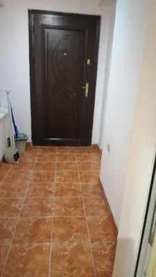 a room with a door with a tile floor at Апартамент 27 юли 1 in Varna City