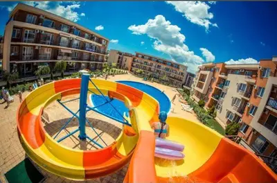 a water slide in a playground in a city at Studio in a Resort with 9 pools in Sunny Beach