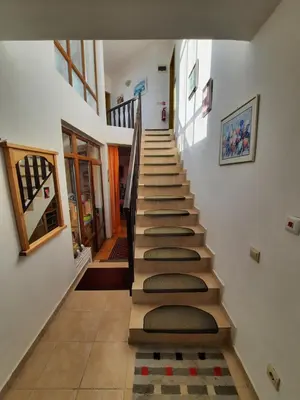 a stairway in a house with a bunch of steps at Villa Jasmin in Aheloy