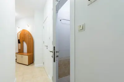 a bathroom with a shower and a sink and a door at Calm space in Varna top center in Varna City