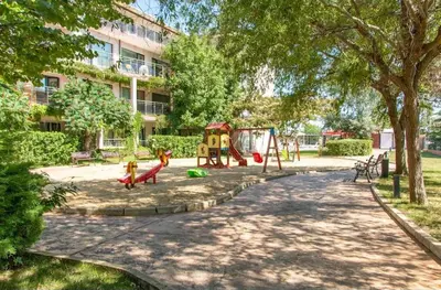 a park with a playground with a swing at Galqna in Sozopol
