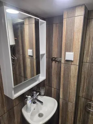 a bathroom with a sink and a mirror at Galqna in Sozopol