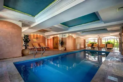 a swimming pool in a house with a large room at Izida Palace Garden SPA Oasis in Bŭnzareto