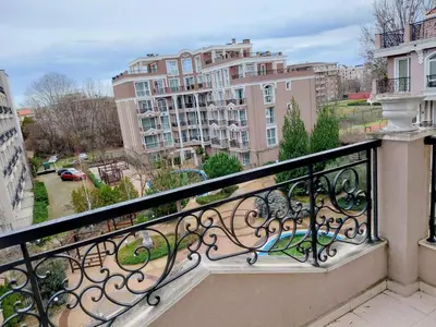 a balcony with a view of some buildings at Izida Palace Garden SPA Oasis in Bŭnzareto