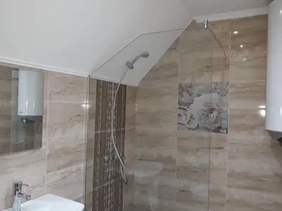 a bathroom with a shower and a sink at South Beach Apartments in Obzor