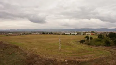 an open field with a telephone pole in the middle at Privately owned Studios Bora Bora in Nesebar