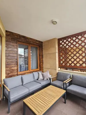 a living room with a couch and a table at Garden of Eden- MintGarden- Sveti Vlas 1 in Sveti Vlas