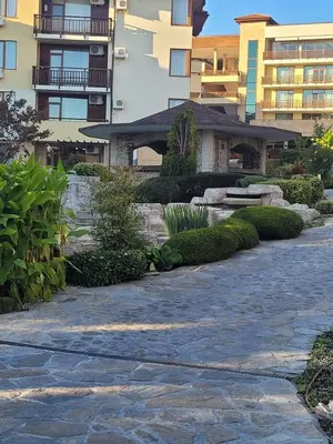 a stone walkway in front of a building at Garden of Eden- MintGarden- Sveti Vlas 1 in Sveti Vlas