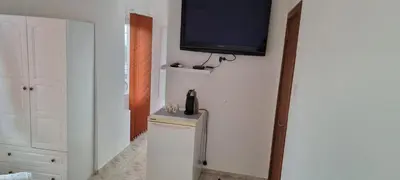 a room with a television on a wall with a trash can at Polonia - KEMNI in Burgas City