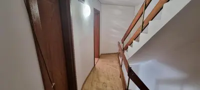 a staircase in a house with a wooden railing at Polonia - KEMNI in Burgas City