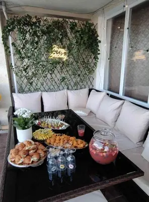 a table with several plates of food on a couch at Polonia - KEMNI in Burgas City