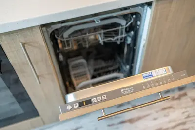 an oven with its door open in a kitchen at Bright City-Center Flat for 4 Guests in Varna City