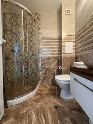a bathroom with a shower and a toilet and a sink at Cozy studio in Sanny Beach in Sunny Beach