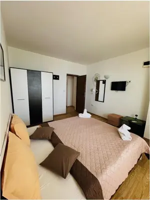 a bedroom with a large bed in a room at Family house ''Siema'' in Nesebar