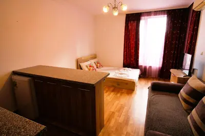 a small living room with a couch and a table at Magnolia 3 - Menada Apartments in Sunny Beach