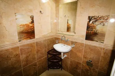 a bathroom with a sink and a mirror at Magnolia 3 - Menada Apartments in Sunny Beach