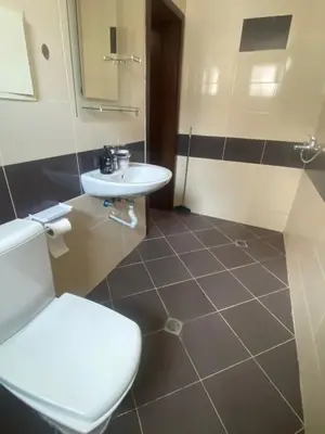 a bathroom with a white toilet and a sink at Amadues Lux, 1 Bed - Central to Sunny Beach in Sunny Beach