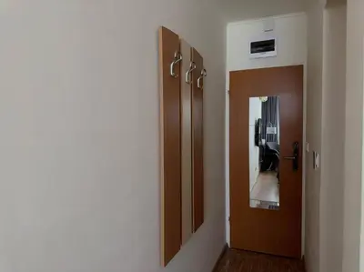 a hallway with a door and a corridorngthngthngthngthngthngthngthngth at Слънчев Бряг Какао с басейн плаж in Sunny Beach