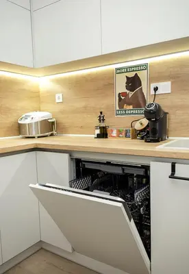 a kitchen with white cabinets and a counter at Stylish 2BR Apartment with Underground Parking, Varna by Flat Manаger in Varna City
