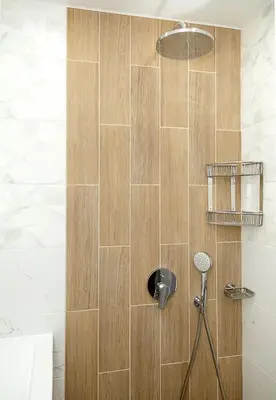 a bathroom with a shower with a shower head at Stylish 2BR Apartment with Underground Parking, Varna by Flat Manаger in Varna City