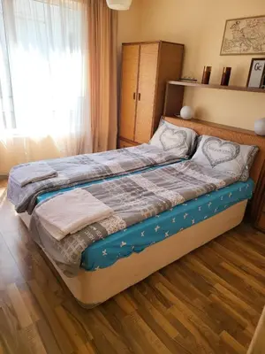 a large bed in a bedroom with a window at Luxury apartment opposite Kakao in Sunny Beach