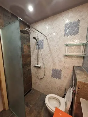 a bathroom with a shower and a toilet at Luxury apartment opposite Kakao in Sunny Beach