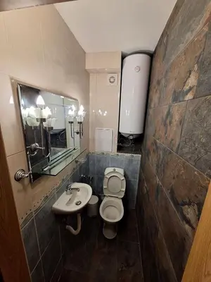 a bathroom with a toilet and a sink at Luxury apartment opposite Kakao in Sunny Beach