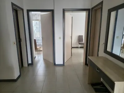 a hallway with two doors and a room with chairs at Sunny sea apartment - 100 meters from the sea in Chernomorets
