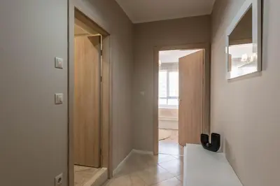 a hallway with a door leading to a room at Seaside Bliss in Varna City