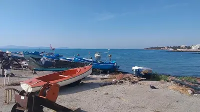 a group of boats on the shore of a beach at Specious apartment near beautiful beach Pomorie in Pomorie